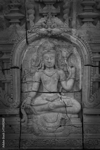 Low relief cement Thai style handcraft of hindu gods.