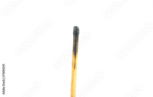 Close-up of a burnt match and a whole red match isolated on a wh