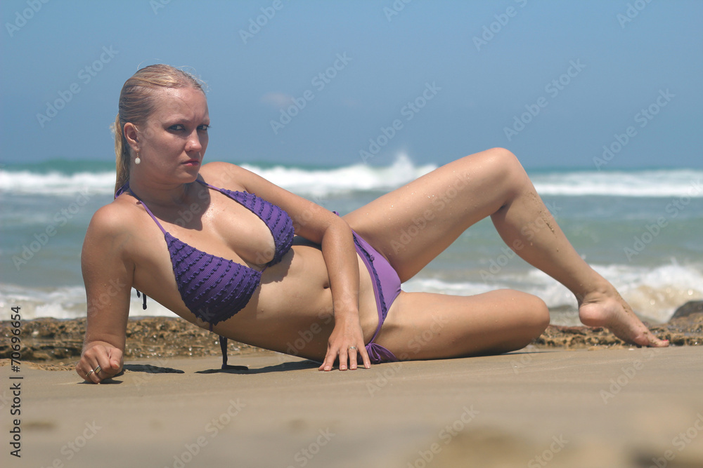 Sexy woman with a bikini lying on the beach Stock Photo | Adobe Stock