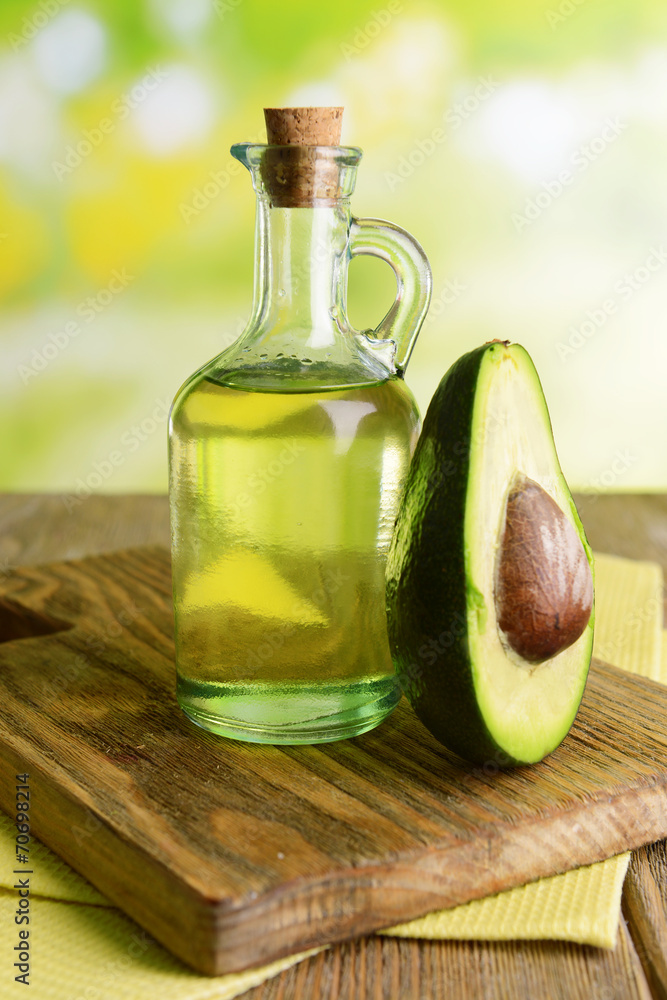 Avocado oil on table on light background Avocado oil on table on light background