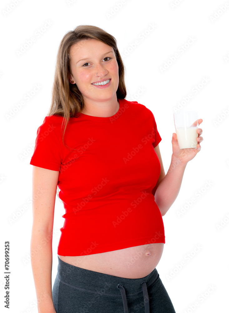 young pregnant woman is drinking milk young pregnant woman is drinking milk