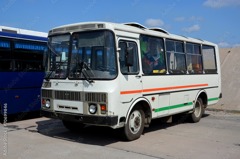 The city bus, standing in the parking