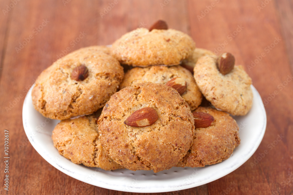 almonds cookies on the white plate almonds cookies on the white plate