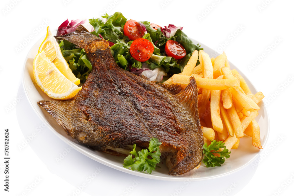 Fish dish - fried fish fillet with vegetables Fish dish - fried fish fillet with vegetables