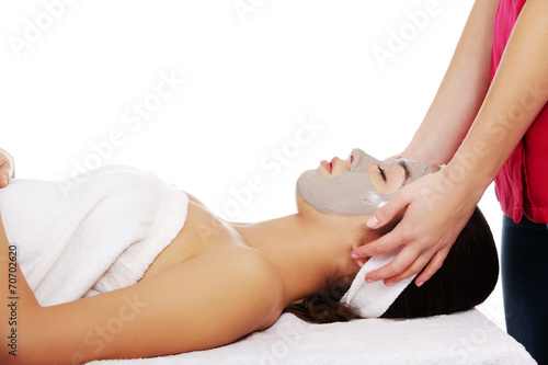 Relaxed woman with a nourishing face mask