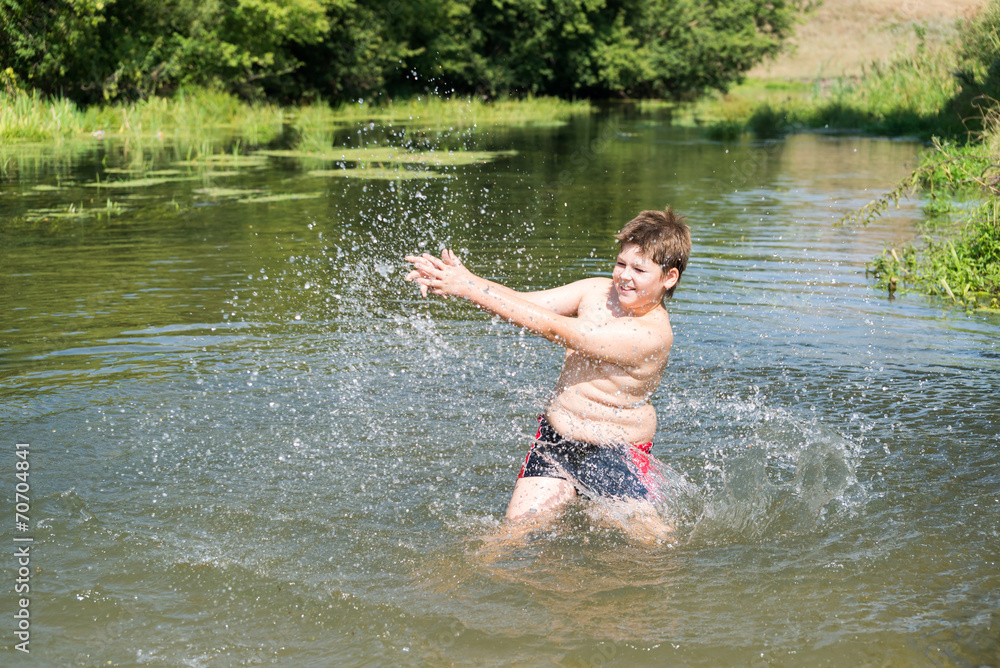 Fototapeta premium Full 10 years boy swim in river