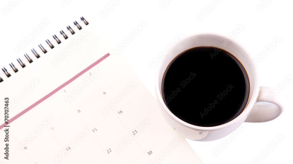 A mug of coffee and table day planner A mug of coffee and table day planner