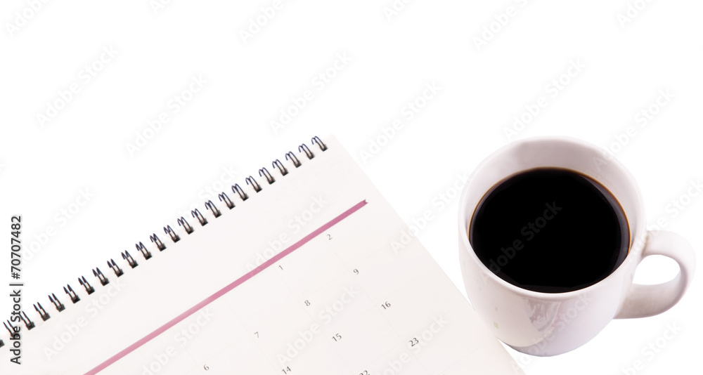A mug of coffee and table day planner A mug of coffee and table day planner