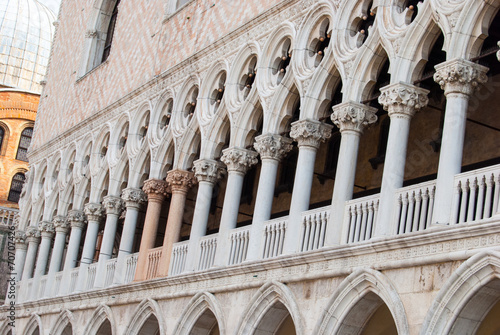 Corner of Doge's Palace on San Marco square and bell tower of Sa