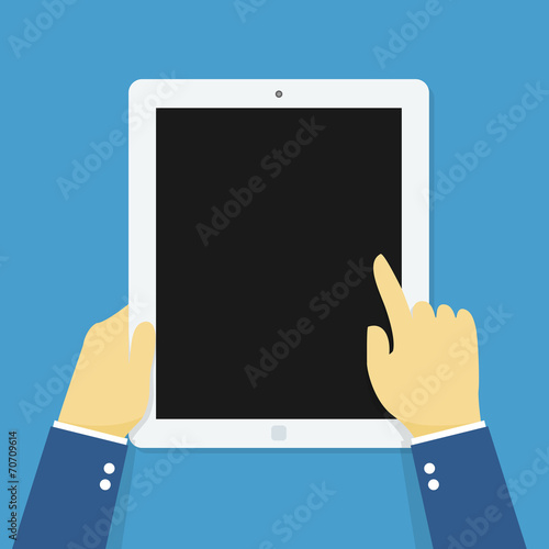 Hand holding touching tablet.