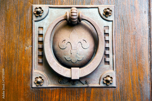 knocker in a  door curch  closed wood italy   cross photo