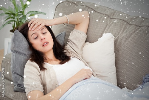 Indisposed woman feeling her temperature