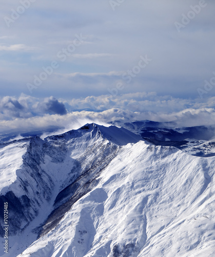 Winter mountains in mist at windy winter day © BSANI
