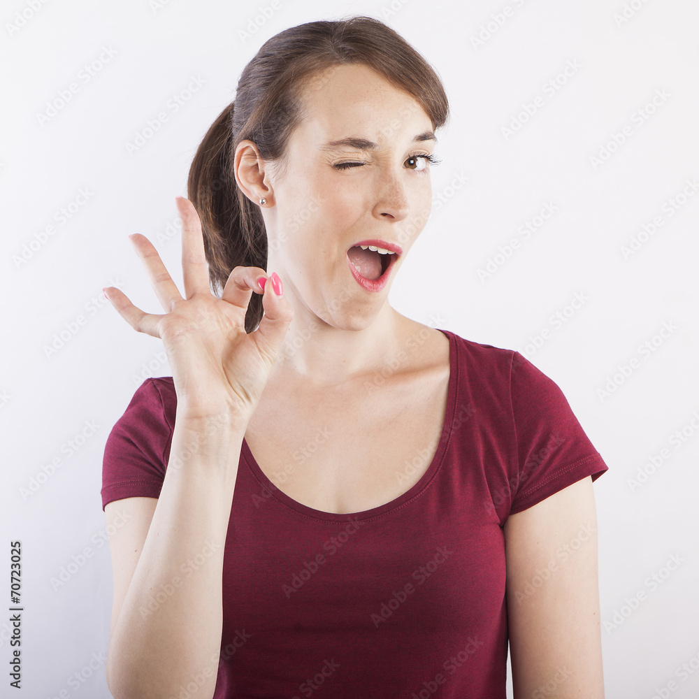 young beautiful woman doing ok gesture young beautiful woman doing ok gesture