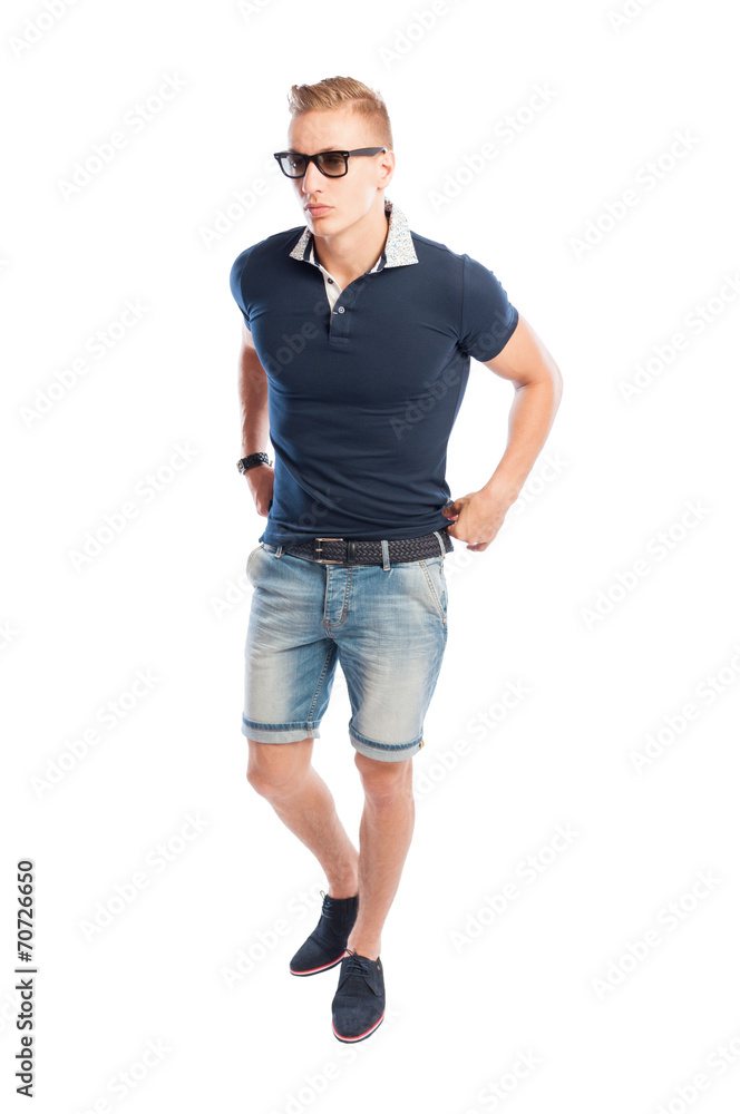 Male model fixing his tide t-shirt. Male model fixing his tide t-shirt.