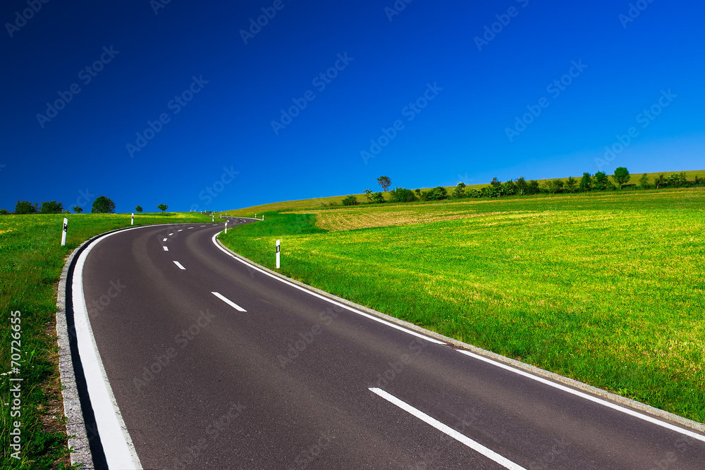 Fototapeta premium Empty highway in the beautiful sunny weather and clear blue sky