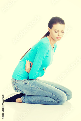 Young woman with stomach issues photo