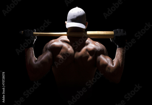 Baseball player from behind in dramatic lighting