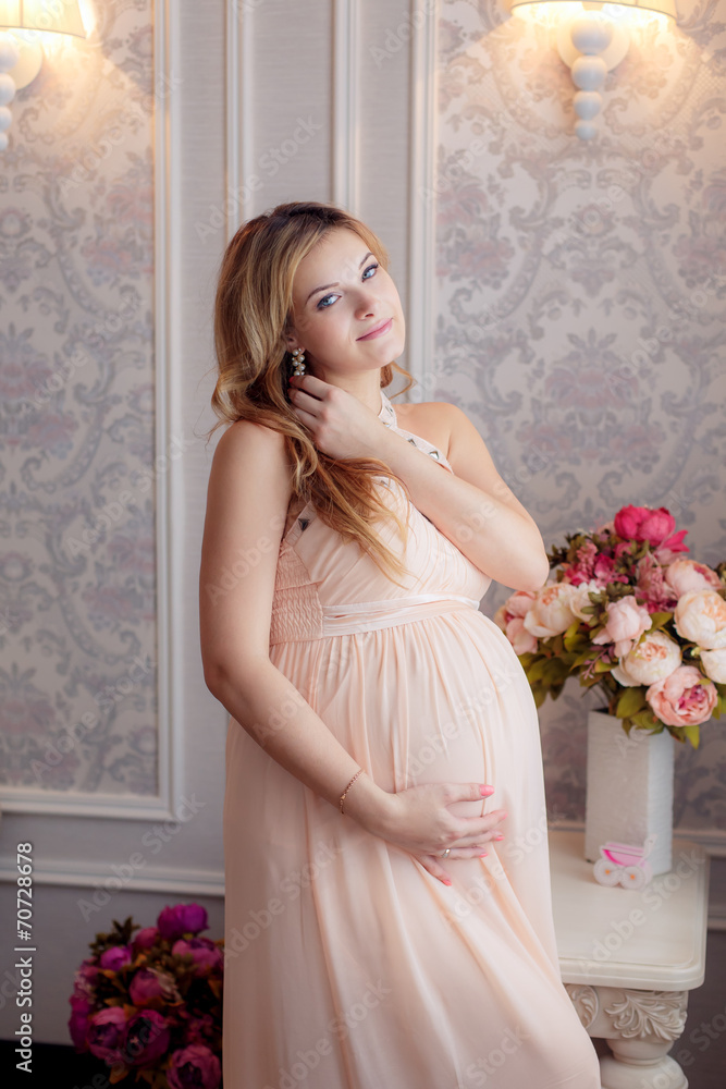Happy pregnant woman in the room Happy pregnant woman in the room
