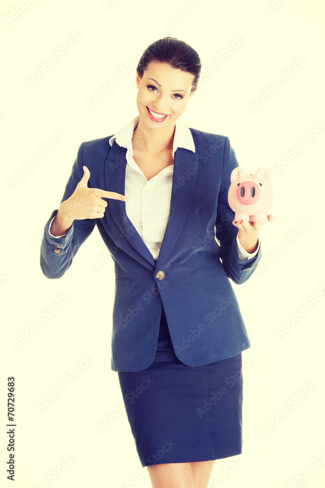 Business woman with her piggy bank.