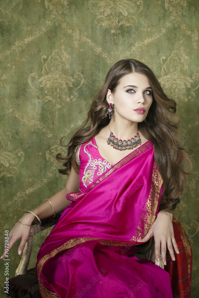 Young pretty woman in indian red dress Young pretty woman in indian red dress