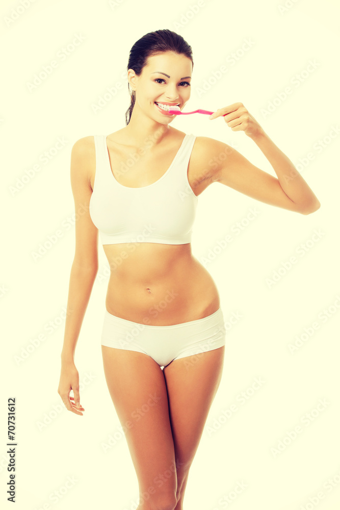 Woman with great teeth holding tooth brush