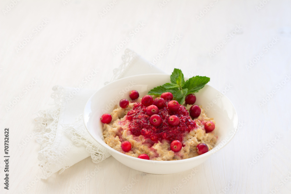 Oatmeal with cranberry jam, fresh cranberries and honey Oatmeal with cranberry jam, fresh cranberries and honey