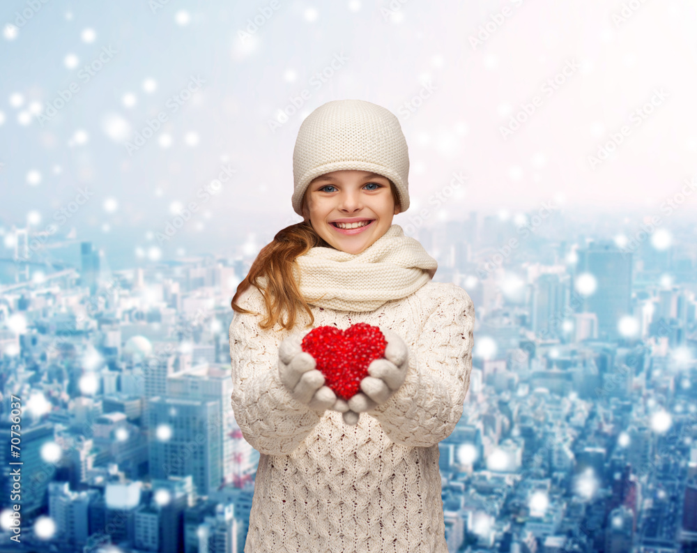 dreaming girl in winter clothes with red heart dreaming girl in winter clothes with red heart