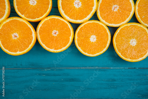 Fresh organic oranges on wooden background