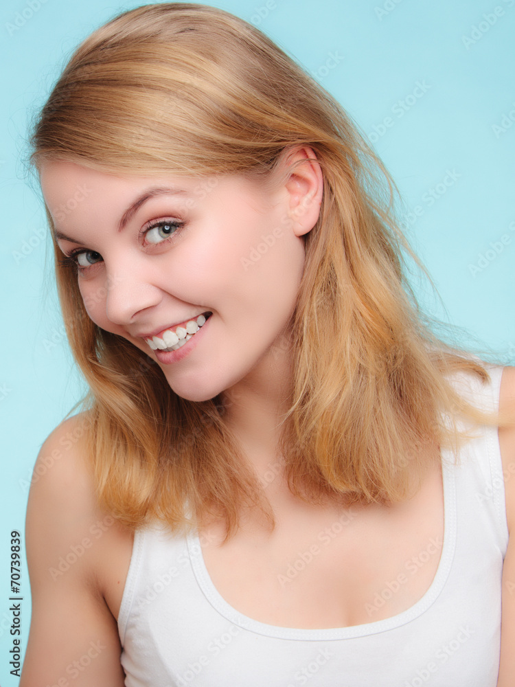 Portrait happy girl smiling woman on blue. Dental. Portrait happy girl smiling woman on blue. Dental.