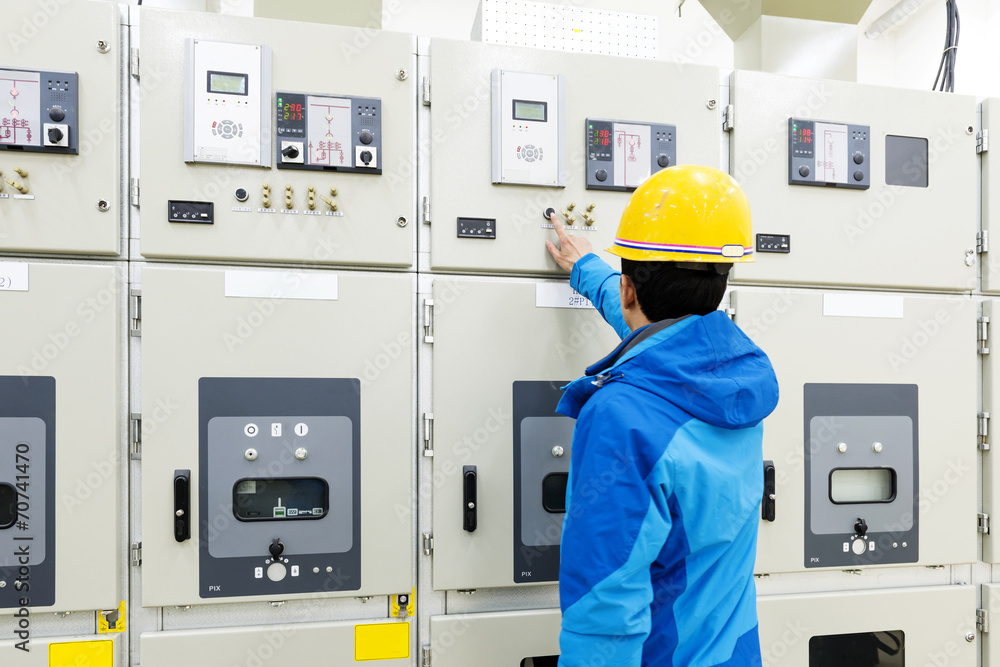 man hand pressing button - starting industrial process man hand pressing button - starting industrial process