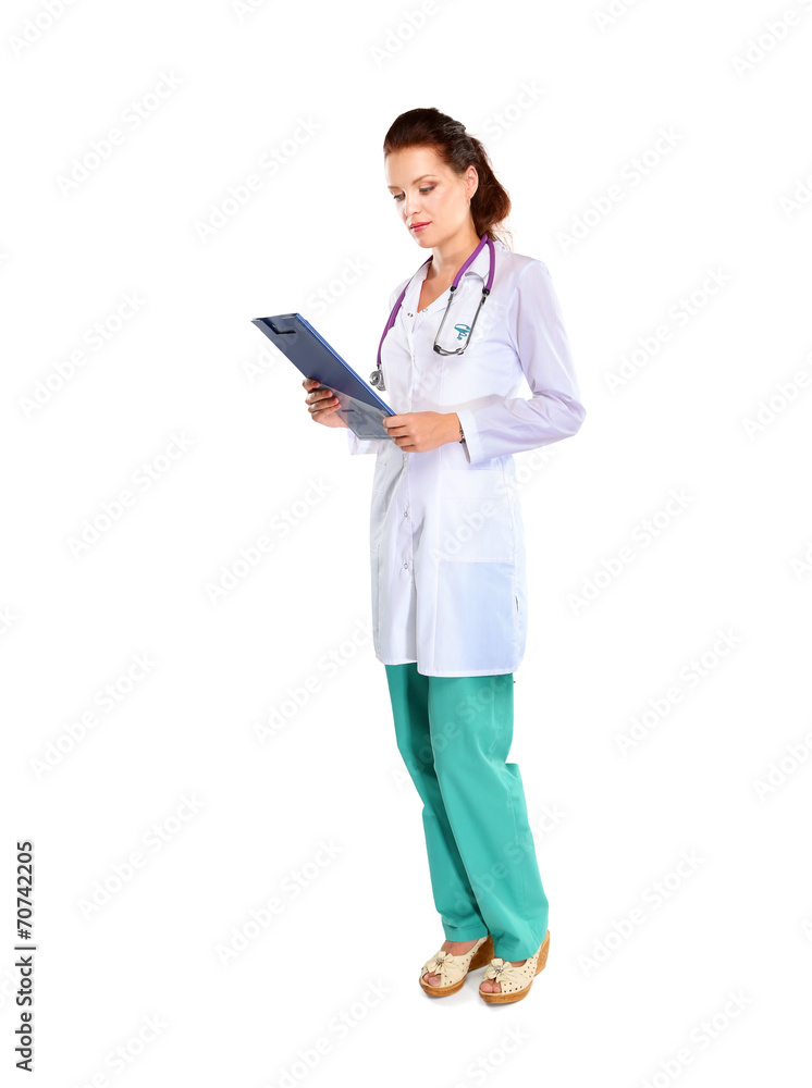 Smiling female doctor with a folder in uniform standing at Smiling female doctor with a folder in uniform standing at