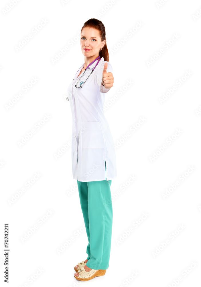 Young woman doctor showing ok , standing in hospital Young woman doctor showing ok , standing in hospital