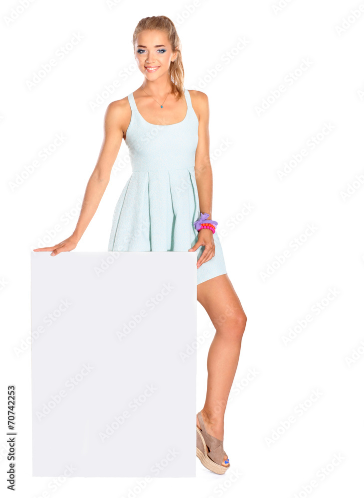 Young woman standing near blank board banner ,isolated on white Young woman standing near blank board banner ,isolated on white
