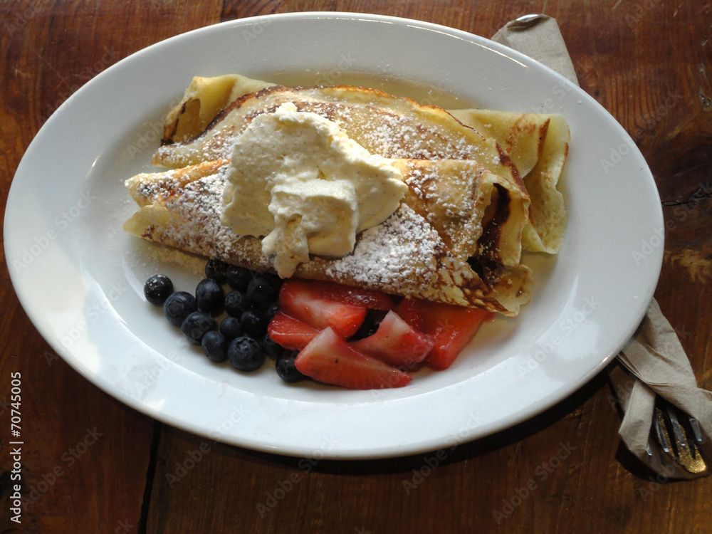 Sweet Crepes Served with sugar ice cream, blueberries and Strawb