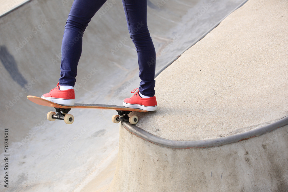 skateboarding woman legs at skatepark skateboarding woman legs at skatepark