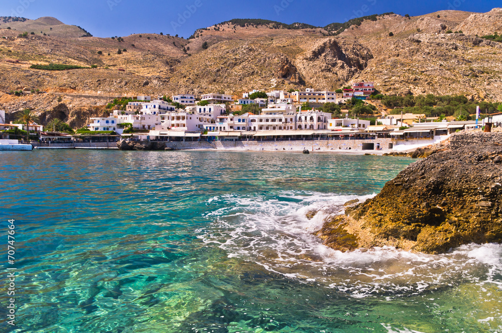 Small harbor with village at south side of Crete island