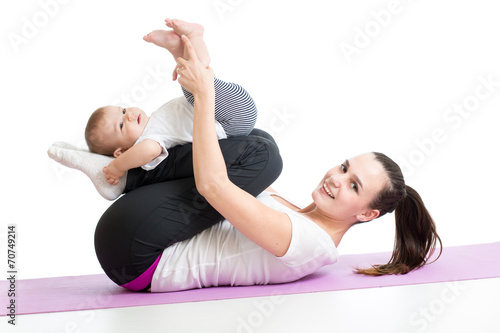 mother with child do gymnastic and fitness exercises