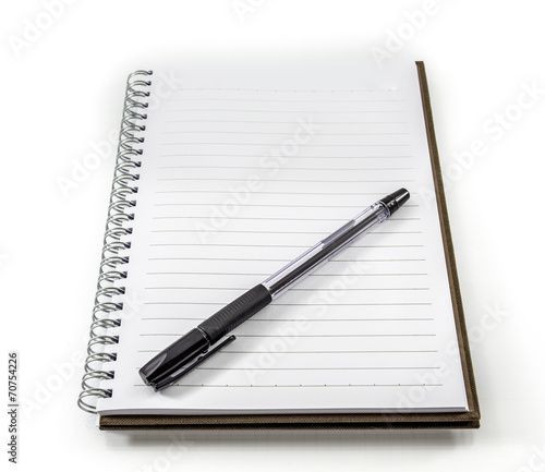 pen on blank notebook