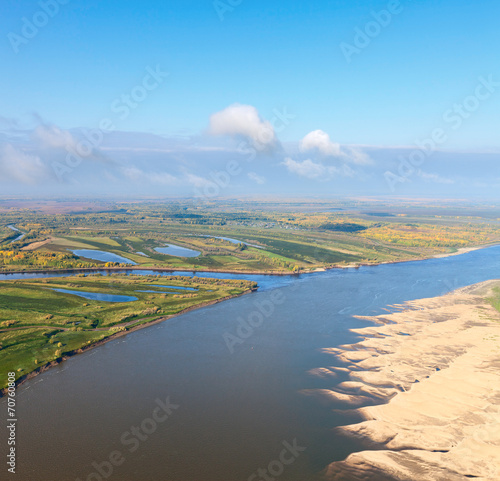 Terrain with great river in autumn, top view