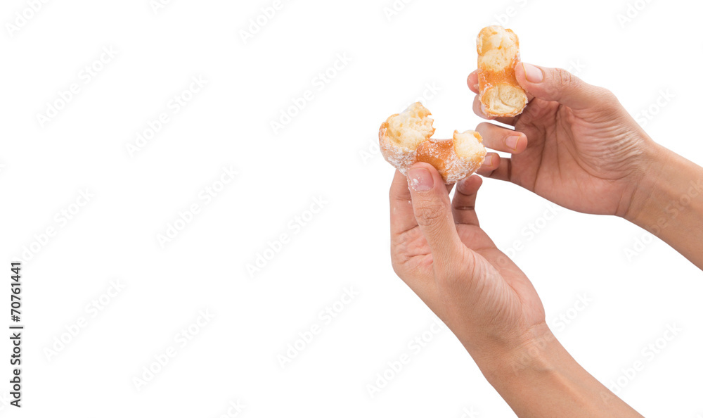 Female hand holding doughnuts over white background Female hand holding doughnuts over white background