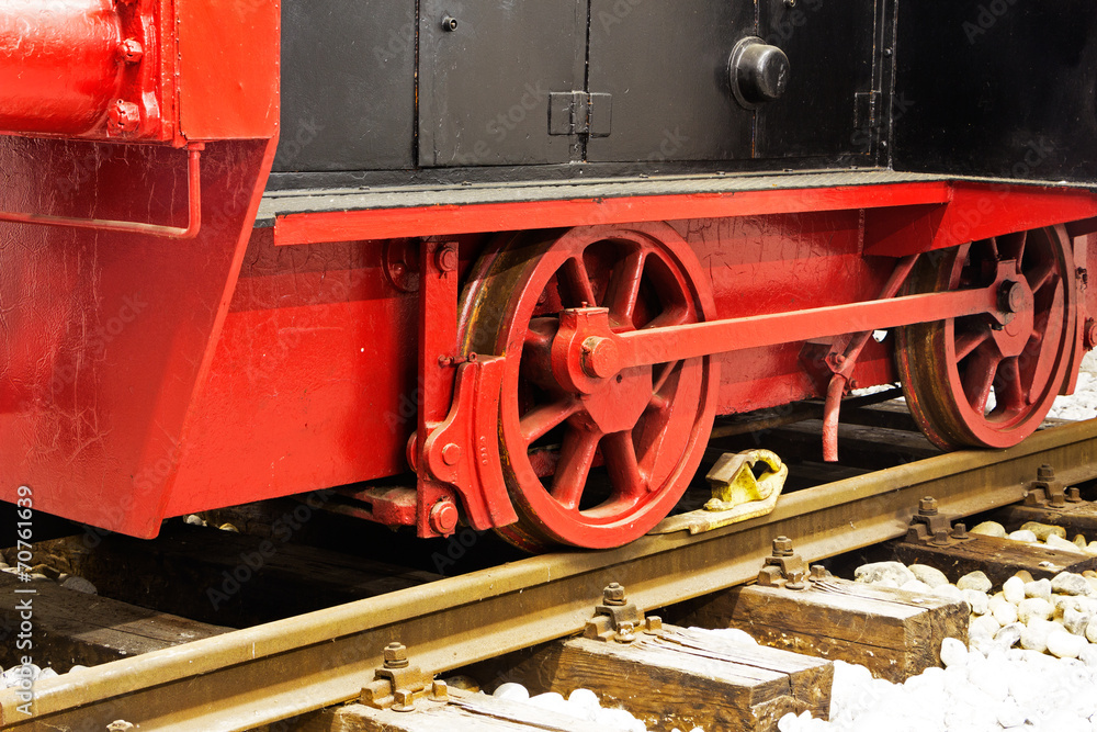 Naklejka premium Wheels of old locomotive on the rails
