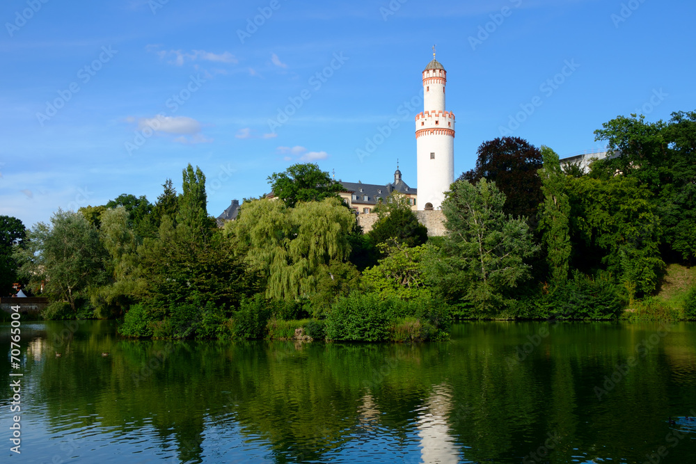 Watchtower reflecting in pond