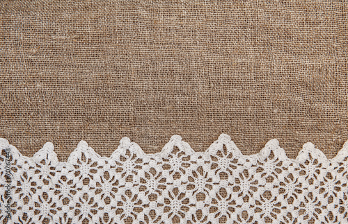 Burlap background with lacy cloth