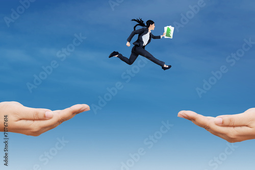Entrepreneur jump through two hands