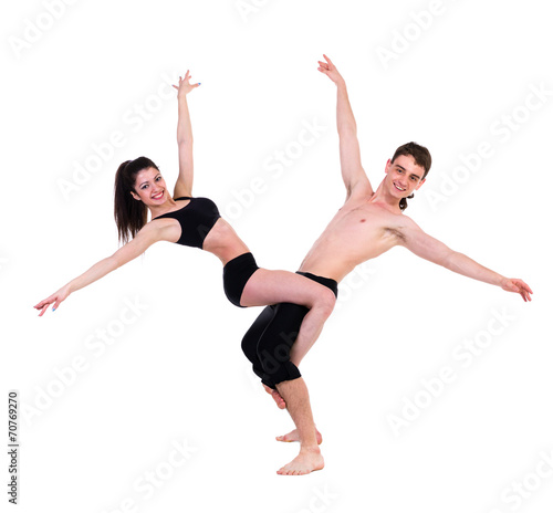 Fototapeta Naklejka Na Ścianę i Meble -  couple man and woman exercising fitness dancing on white