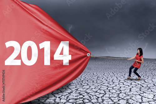 Woman is pulling new year of 2014