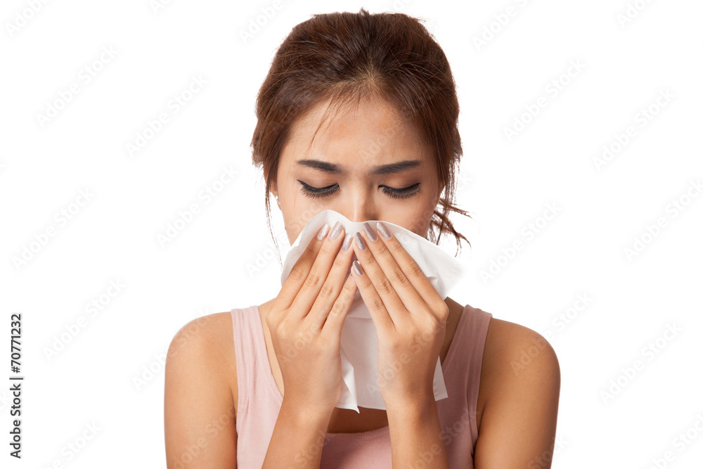 Pretty Asian girl Caught Cold. Sneezing into Tissue. Pretty Asian girl Caught Cold. Sneezing into Tissue.