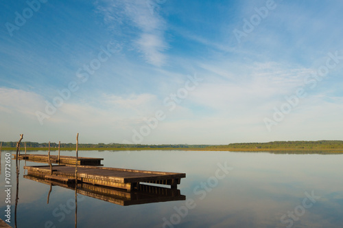 Wooden pier in a lake. Sunrise at Soustons  France