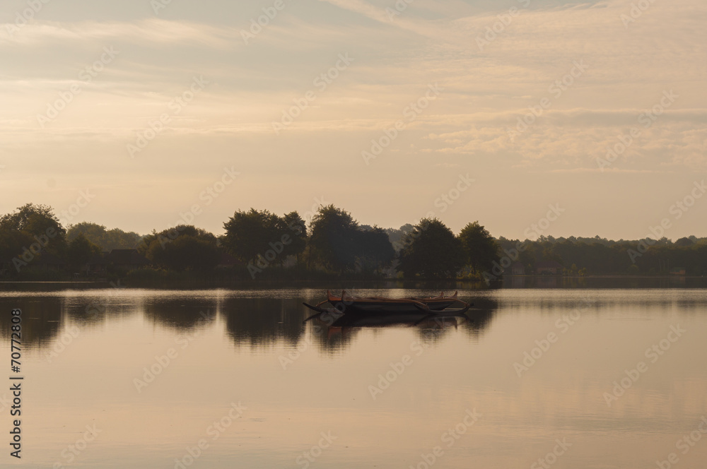 Fototapeta premium Wooden boat in the lake shore
